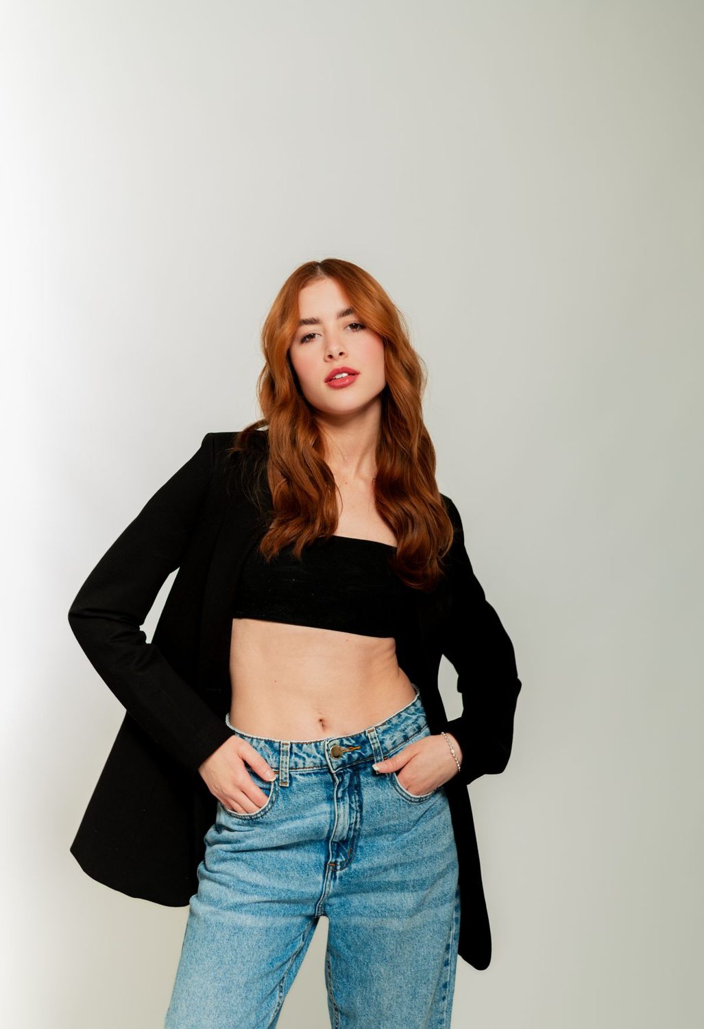 Black blazer worn with blue denim jeans