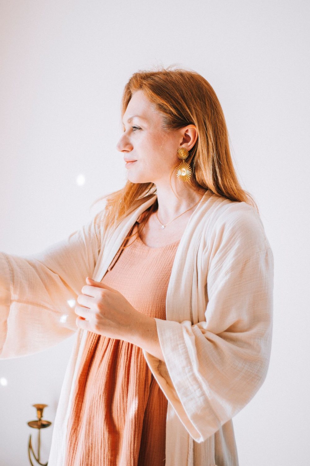 Woman wearing a cardigan over a flowing dress