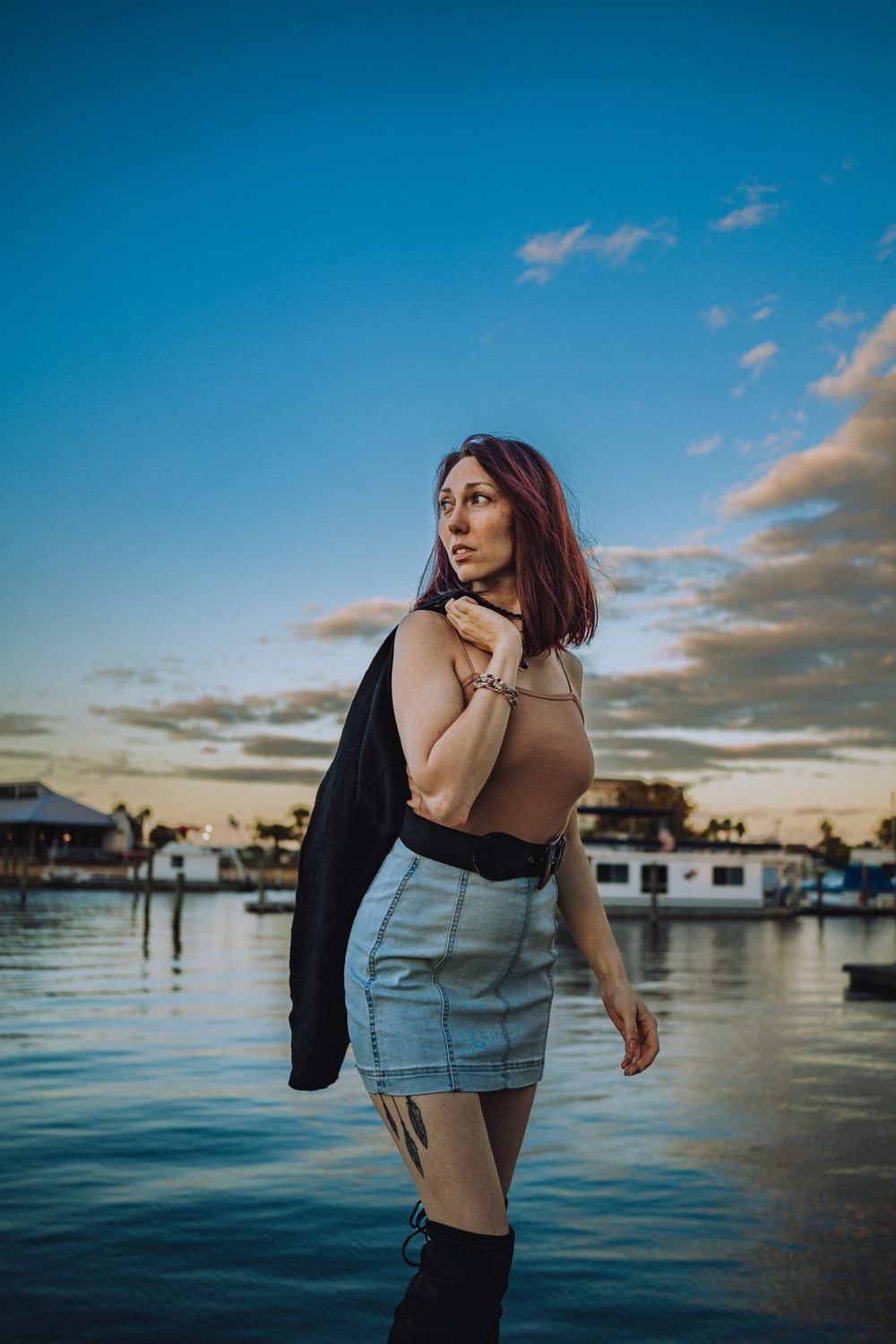 Woman wearing a denim skirt by the waterfront
