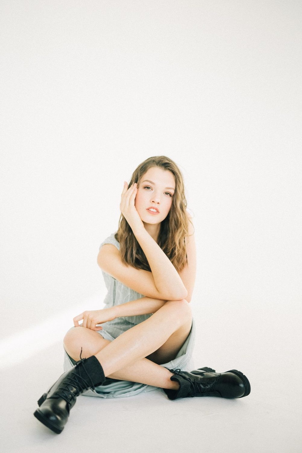 Woman wearing a dress with black boots
