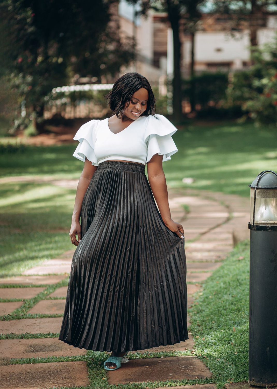 Woman walking in a long pleated skirt