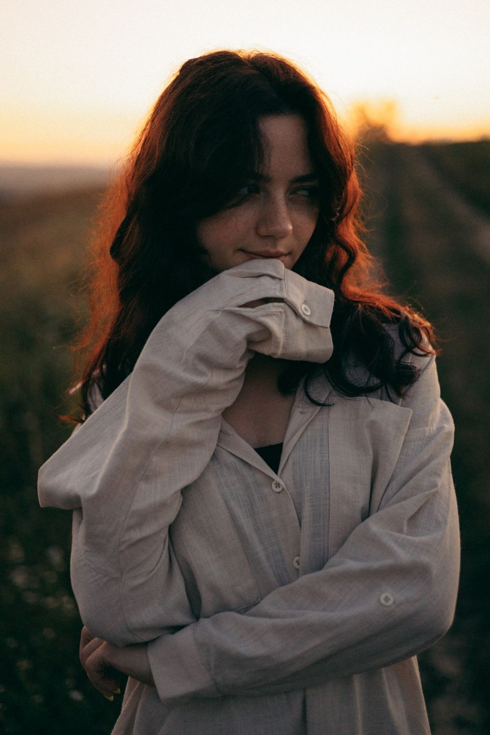 Woman wearing a loose oversized shirt outdoors