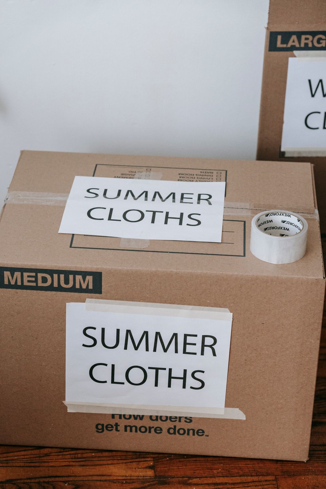 Storage boxes labelled for summer clothes