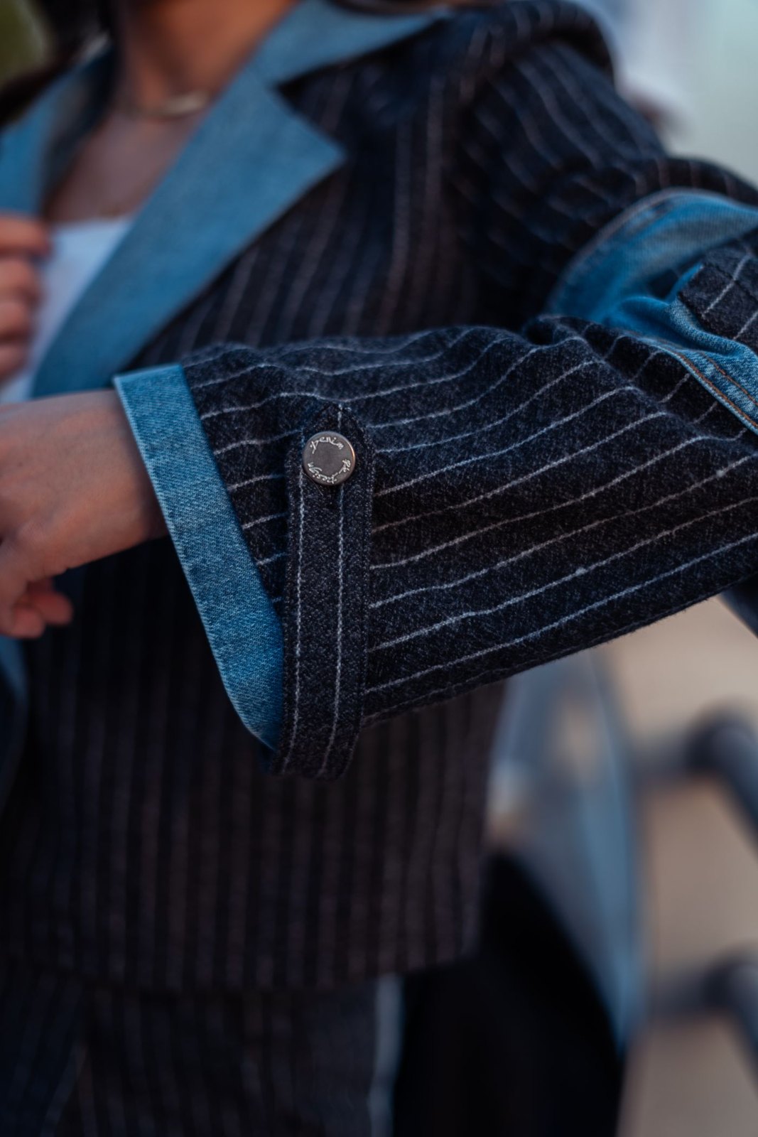 Jacket cuffs with denim and pinstriped fabric