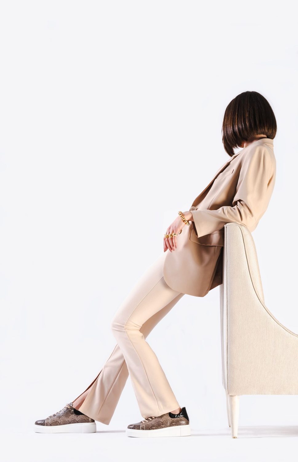 Beige garments layered in a tonal outfit